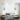 Grijze Scandinavische hanglamp boven het bed